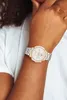 A close-up shot of a person's wrist wearing a Tommy Hilfiger watch. Náhľad obrázku produktu