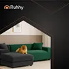 A dog sits on a sectional sofa in a living room setting, with a logo and decorative lines in the background. Podgląd zdjęcia produktu