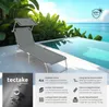 A gray lounge chair with a canopy is set up next to an infinity pool overlooking the ocean. Náhled obrázku produktu