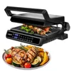 A black electric grill with food on it and a plate of grilled food in front of it. Produktbild-Vorschau