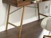 A close-up view of the legs and underside of a wooden desk with golden metal supports. Voir les images du produit