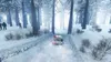 A rally car driving through a snowy forest. Produktbild-Vorschau