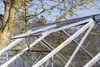 Close-up view of an open greenhouse roof vent. Produktbild-Vorschau