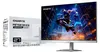 A GIGABYTE gaming monitor is shown next to its packaging, with a dynamic gaming scene displayed on the monitor screen. Podgląd zdjęcia produktu