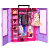 An open doll wardrobe with clothes and accessories. Anteprima dell’immagine prodotto