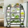 A multi-tiered plant stand with integrated grow lights, filled with various potted plants. Produktbild-Vorschau