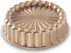 A gold-colored cake pan with a fluted design. Produktbild-Vorschau