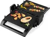 A close-up, slightly angled shot of an open electric grill with various foods cooking on its surfaces. Produktbild-Vorschau