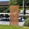 A decorative screen is placed on a patio next to outdoor furniture and plants. Náhled obrázku produktu