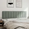 A headboard is shown mounted on a wall above a bed. Produktbild-Vorschau