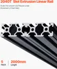 A close-up, angled view of several black aluminum extrusion linear rails. Náhled obrázku produktu