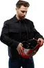 A man holding an Iron Man helmet. Podgląd zdjęcia produktu