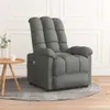 A gray fabric massage chair is shown in a room with a small side table and a plant. Náhľad obrázku produktu