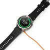 A smartwatch is shown connected to a charging cable. Produktbild-Vorschau