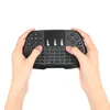Hands holding a black wireless keyboard with a touchpad. Produktbild-Vorschau