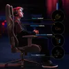 A young person wearing headphones sits in a gaming chair, with diagrams and text highlighting the chair's features. Podgląd zdjęcia produktu