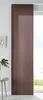 A brown sliding curtain panel hangs in front of a window, with a small table and plant to the left. Produktbild-Vorschau