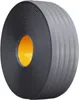 A roll of dark gray anti-slip tape with an orange core. Náhľad obrázku produktu