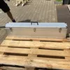 A silver case is placed on a wooden pallet outdoors. Produktbild-Vorschau