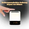 A hand is shown touching a bedside lamp with a digital clock display. Produktbild-Vorschau