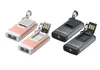 Two pairs of small LED flashlights with USB connectors, one pair in gold and the other in gray. Anteprima dell’immagine prodotto