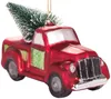 A red glass Christmas ornament shaped like a vintage pickup truck carrying a small green Christmas tree. Voir les images du produit
