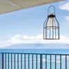 A solar lantern hangs on a balcony overlooking the ocean. Náhľad obrázku produktu