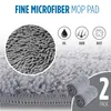 A close-up of microfiber mop pads with icons indicating their cleaning capabilities. Podgląd zdjęcia produktu