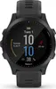 A black Garmin Forerunner smartwatch is shown with its screen displaying the time, date, and fitness data. Náhled obrázku produktu