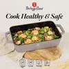 A baking dish filled with food, placed on a wooden board, with marketing text and safety icons. Náhled obrázku produktu