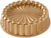 A gold-colored cake pan with a fluted design. Produktbild-Vorschau