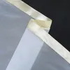 A close-up view of a sheer curtain with a satin ribbon trim. Produktbild-Vorschau
