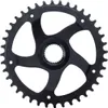 A black bicycle chainring with cutouts and teeth is shown against a white background. Produktbild-Vorschau
