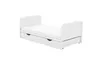A white baby bed with a mattress and a pull-out drawer underneath, shown against a white background. Produktbild-Vorschau