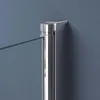 A close-up view of a glass shower door hinge and frame against a blue wall. Produktbild-Vorschau