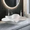 A modern bathroom sink with a sleek faucet and soap dispensers. Produktbild-Vorschau