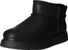A black chelsea boot with a thick sole, shown from the side against a white background. Voir les images du produit