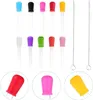 A collection of colorful pipettes and cleaning brushes displayed against a white background. Produktbild-Vorschau