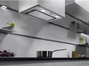 A modern kitchen with a built-in range hood, shelves, and kitchenware. Voir les images du produit