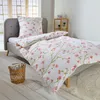 A neatly made bed with floral patterned bedding in a bedroom setting. Produktbild-Vorschau