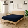 A bedroom scene with a bed featuring a navy blue fitted sheet. Produktbild-Vorschau