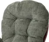 A close-up view of the textured fabric of a green chair cushion. Voir les images du produit