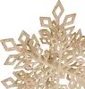 A close-up of a glittery snowflake ornament. Náhled obrázku produktu