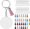 A collection of acrylic keychain blanks and colorful tassels, along with keyrings and jump rings, arranged on a white background. Produktbild-Vorschau