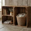 Two wooden crates used for storage, one with books and a vase, the other with a basket and blanket. Náhled obrázku produktu