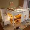 A child's bedroom with a loft bed, toys, and soft furnishings. Voir les images du produit