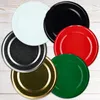 A collection of colorful jar lids arranged on a wooden surface. Podgląd zdjęcia produktu