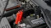 A car battery being jumped with a portable jump starter. Náhled obrázku produktu