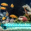 An aquarium with several fish and decorative elements, illuminated by a blue LED light strip. Produktbild-Vorschau