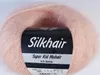 A ball of pink mohair yarn with a label. Produktbild-Vorschau